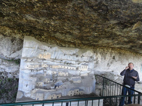 Audouin giving a tour of the cliff caves in Dordogne, France.